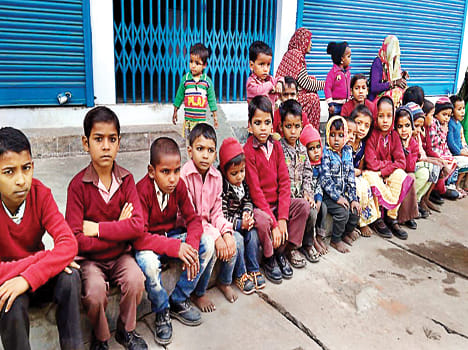 Students leave studies leaving camps in front of bank
