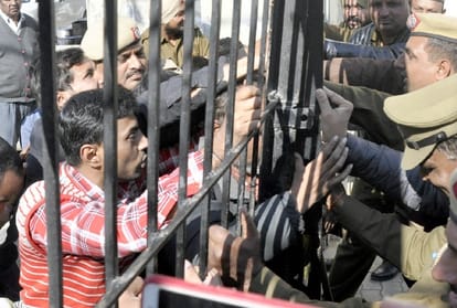 students protest outside the Health Minister's house in Ambala