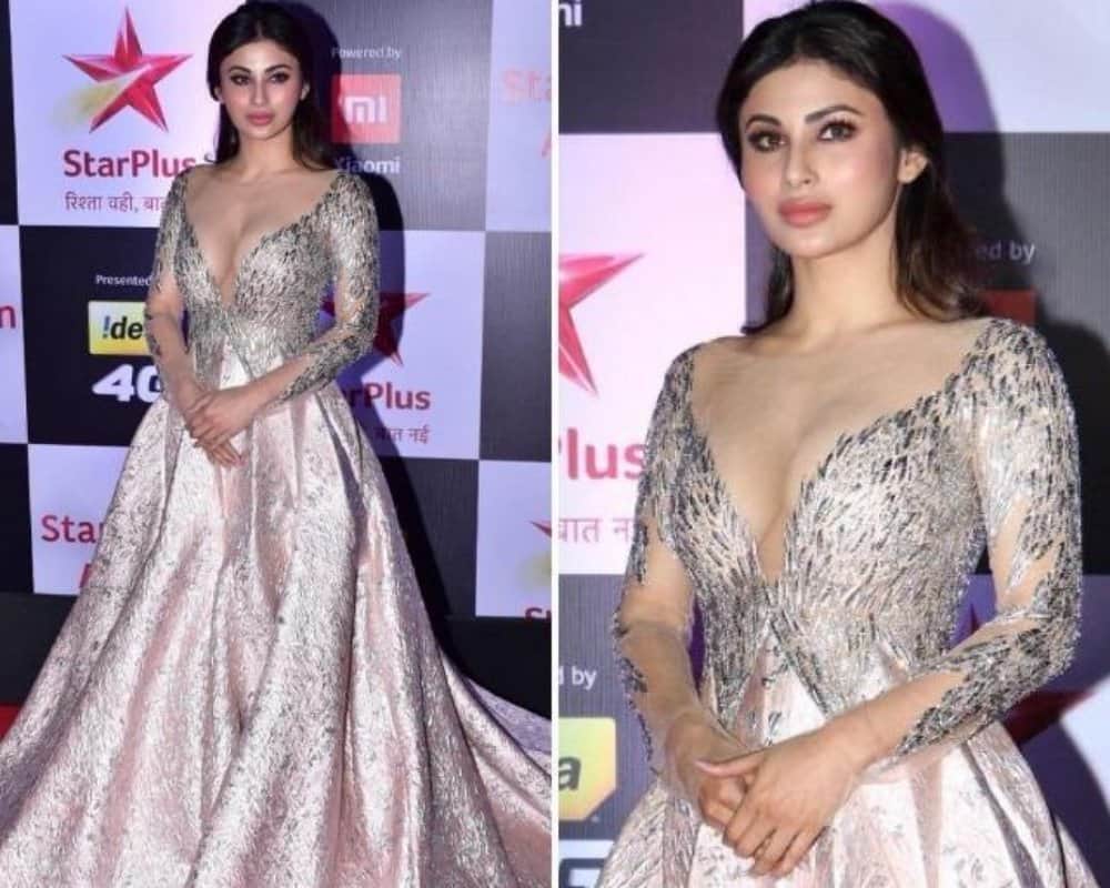mouni roy look hot in her bold silver deep neck dress