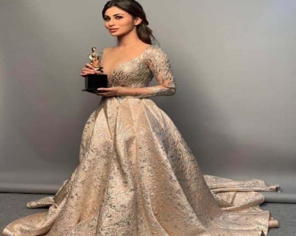 mouni roy look hot in her bold silver deep neck dress