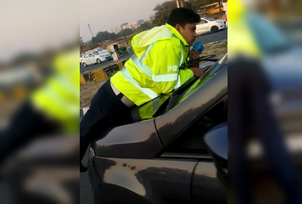Man stop by traffic cop for driving on wrong side in Gurugram, dragged police on bonnet of car