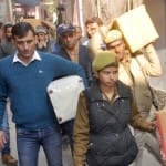 छापेमारी के बाद बरामद सामान ले जाती एटीएस और पुलिस टीम