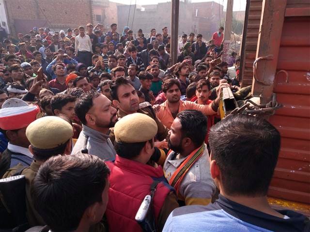 Stacked saffron poultry on trains carrying sabha cattle to school