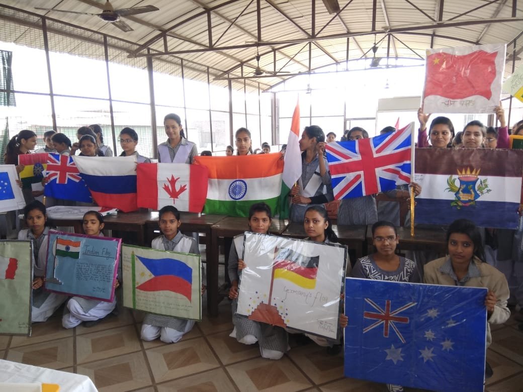Student girls made 40 country flags with hands for migrants honour