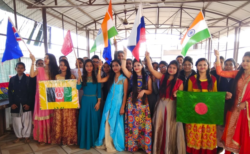 Student girls made 40 country flags with hands for migrants honour