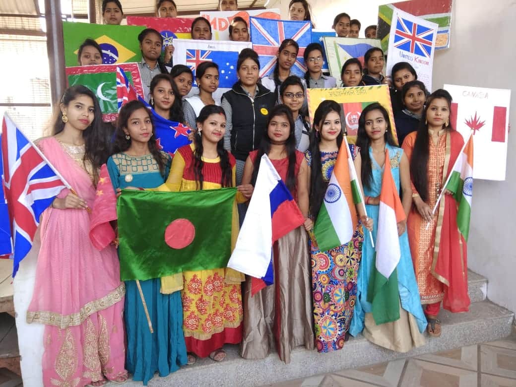 Student girls made 40 country flags with hands for migrants honour