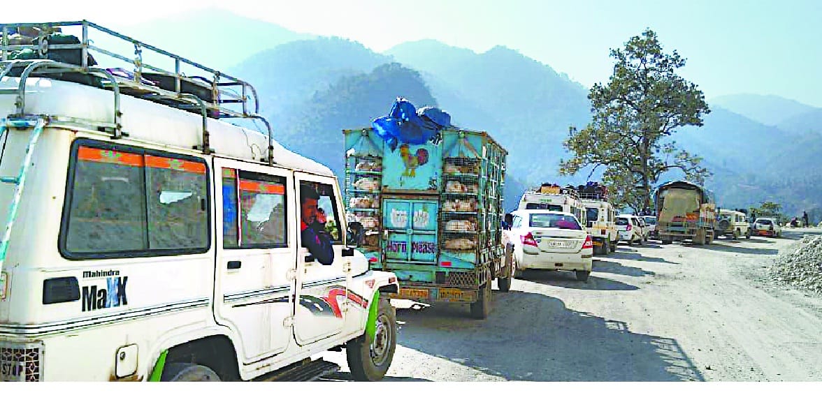 The long jam, the passenger and the driver feeling annoyed every day on the perennial road