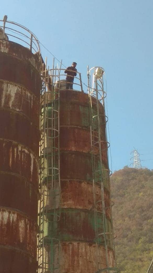 ahpcl suspended 11 employee two of them climb in mixer machine at srinagar garhwal