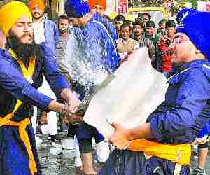 Sikh perform Gatka in prakashotsav