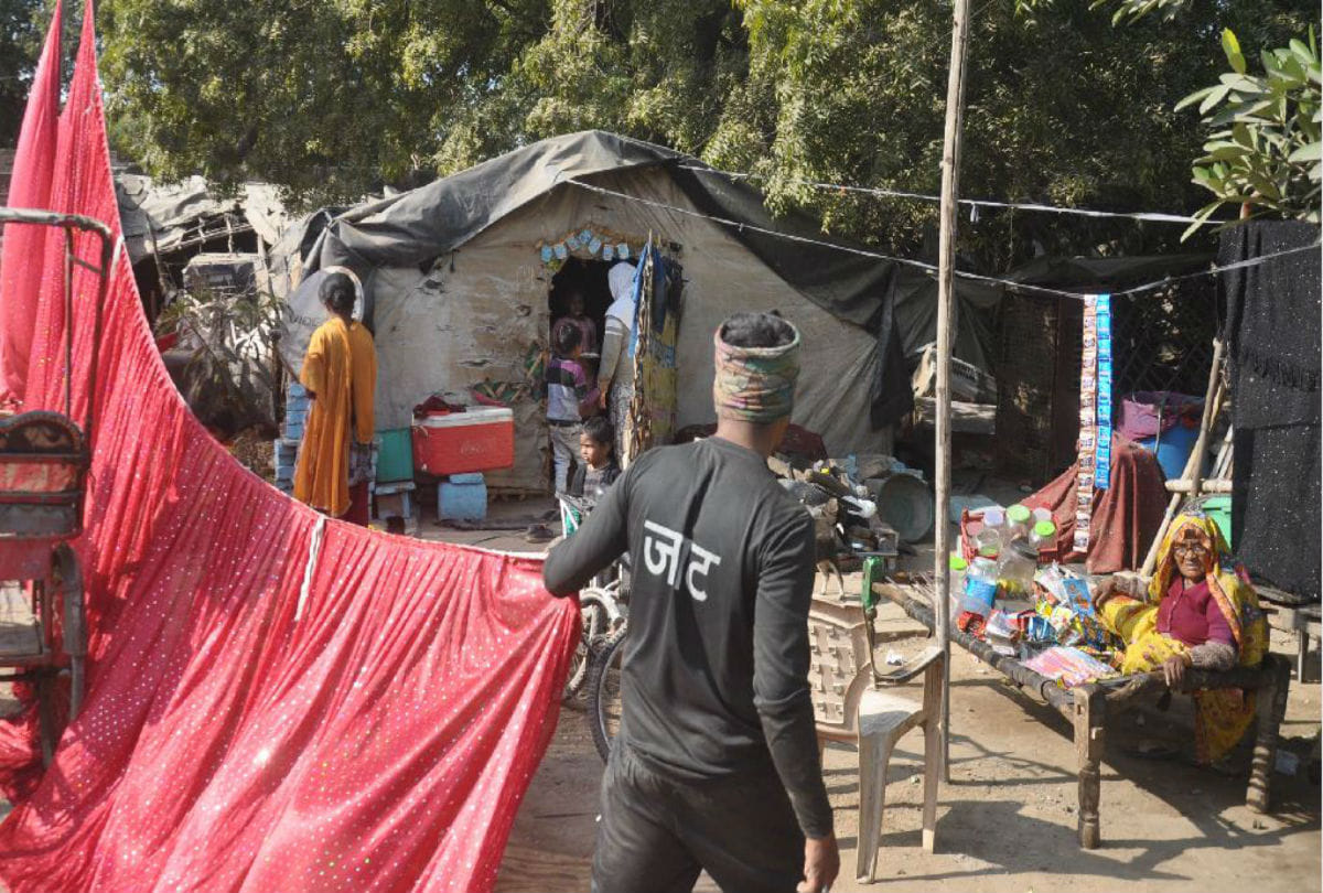 huts of poor families covered with curtains near Narendra Modi's rally venue in agra