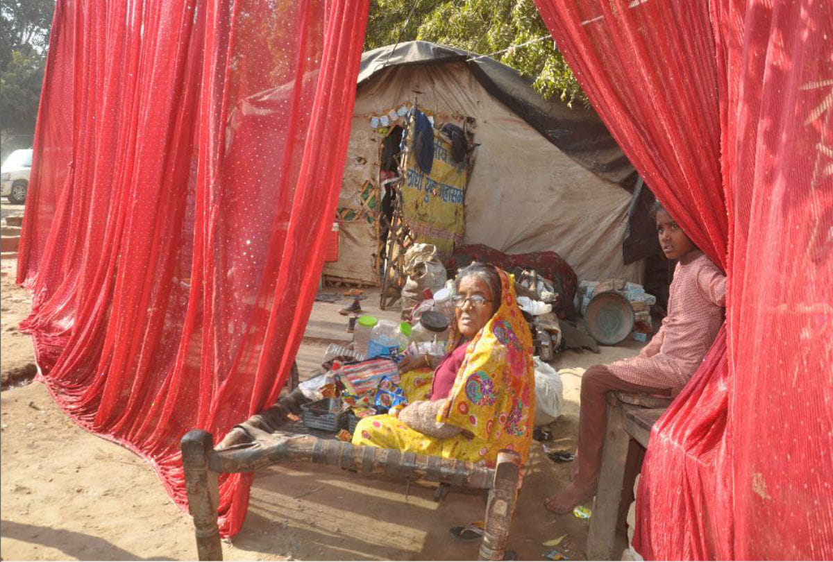 huts of poor families covered with curtains near Narendra Modi's rally venue in agra