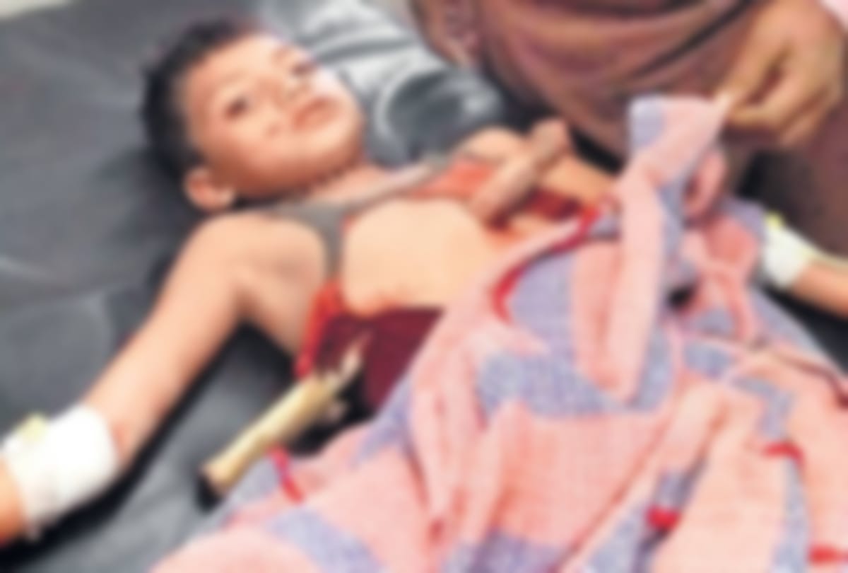 wood stroked stomach of child out in indore