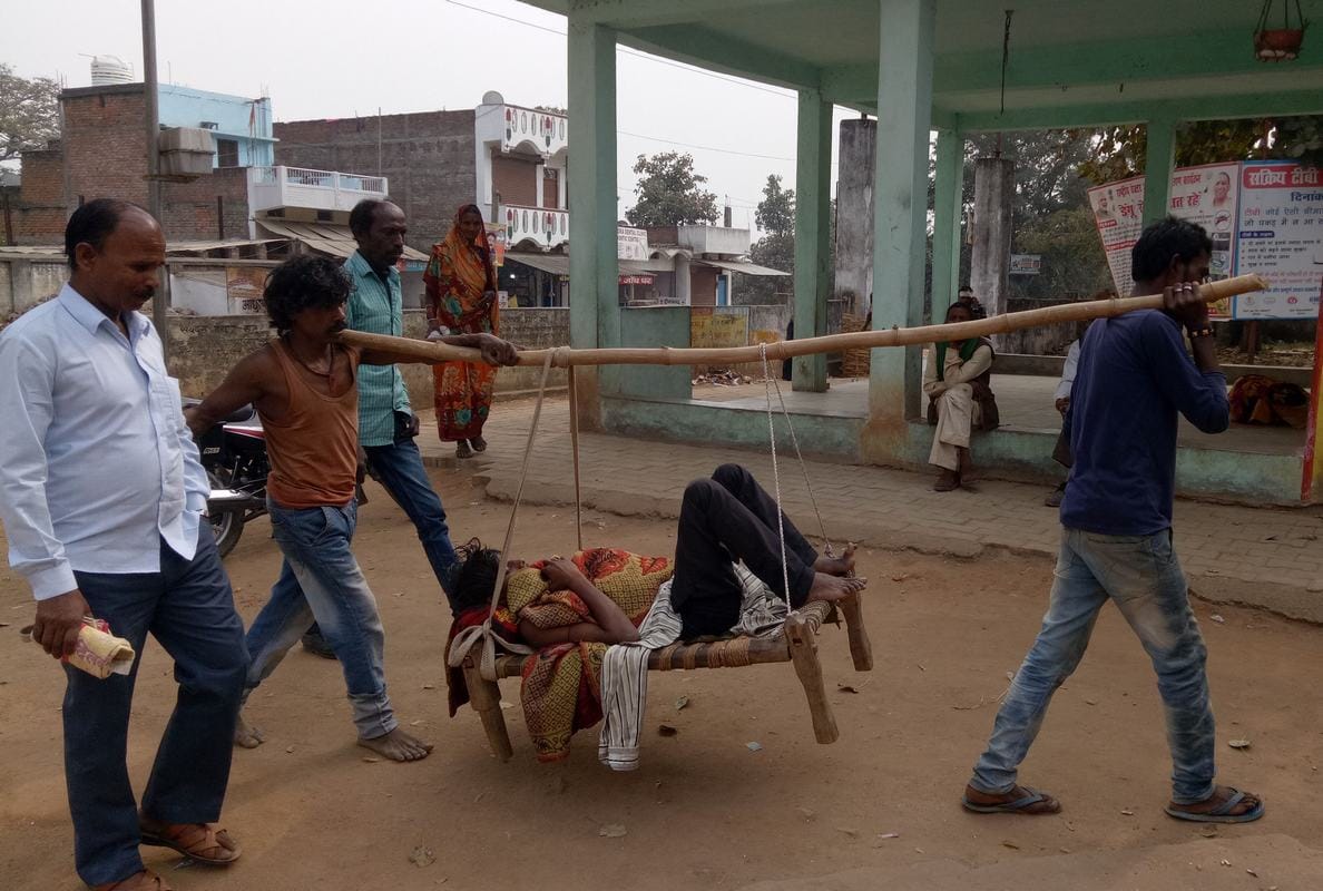 people carry patient on cot after ambulance not came