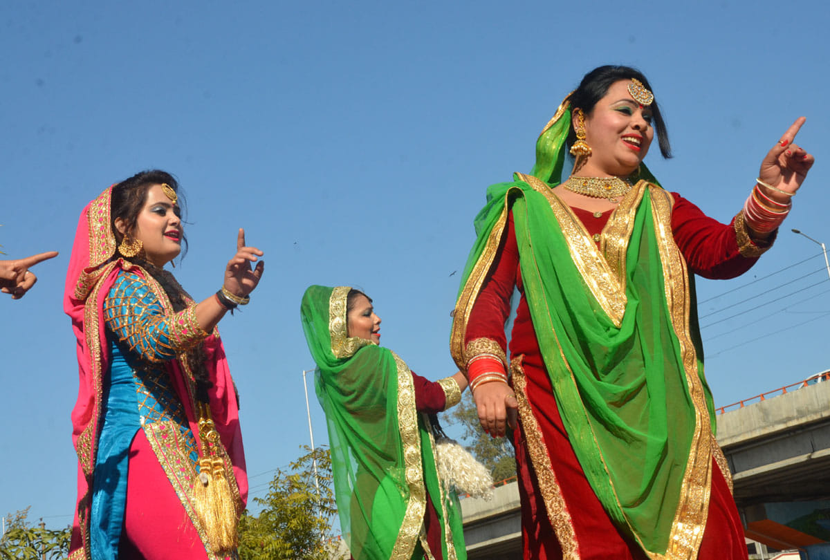 people Celebrating Lohri with fire dancing and singing