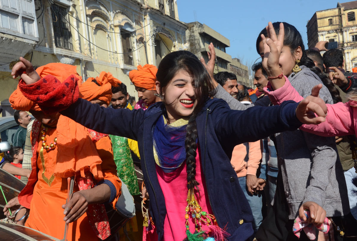 people Celebrating Lohri with fire dancing and singing