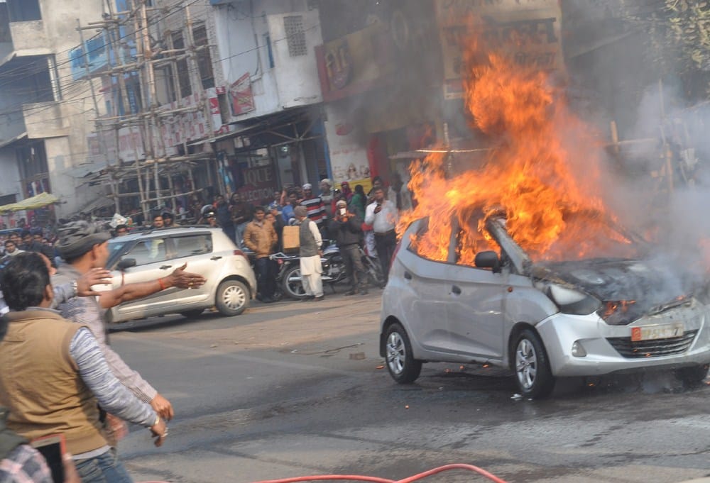 a car burnt on road