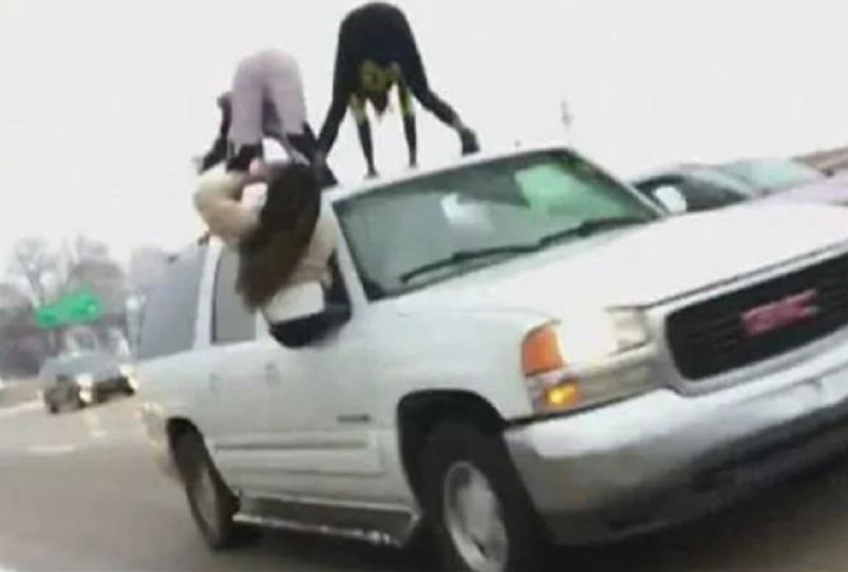 two girls dancing on the top of a moving car viral video