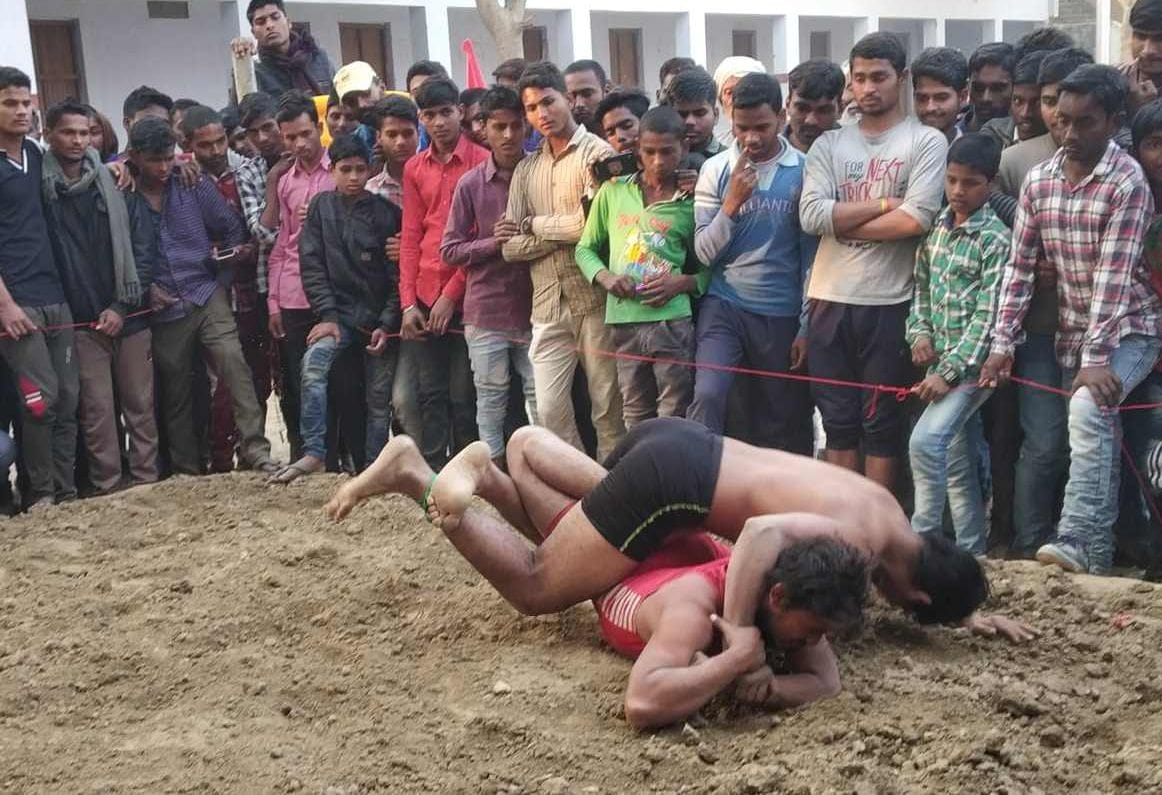 Running, javelin throwing and wrestling showing performance