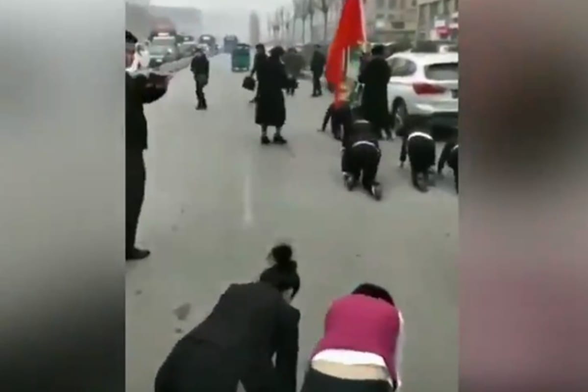 Chinese company forced employees to crawl on road as punishment for not completing targets