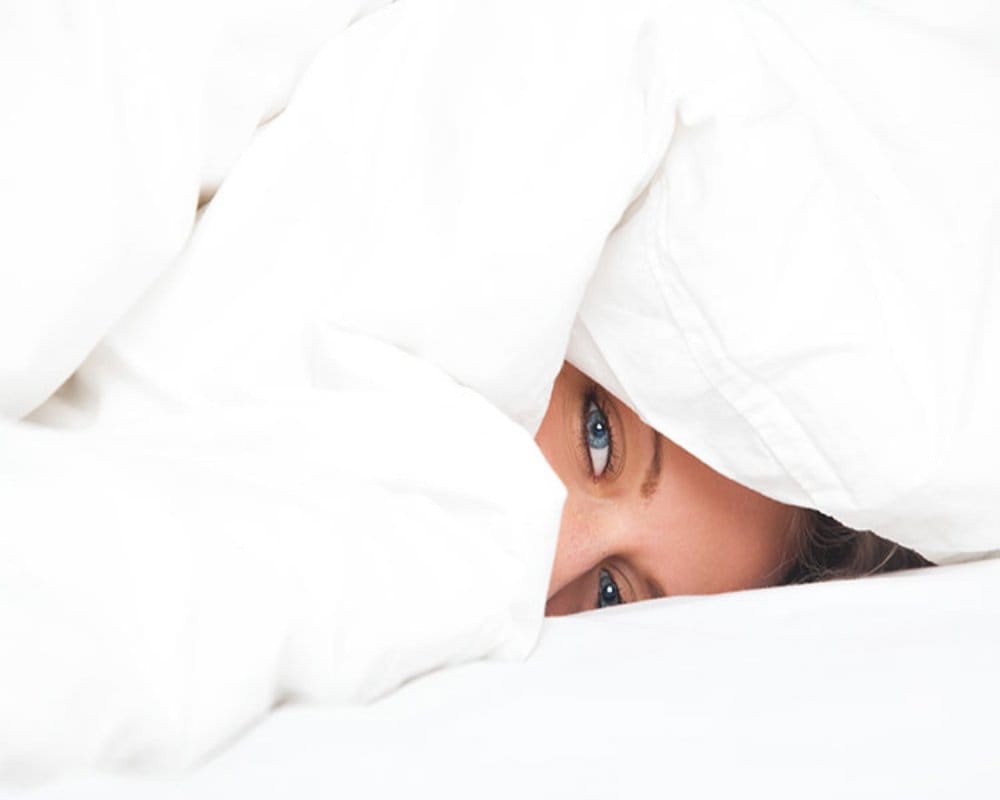 unhealthy to sleeping with blanket over head in winters