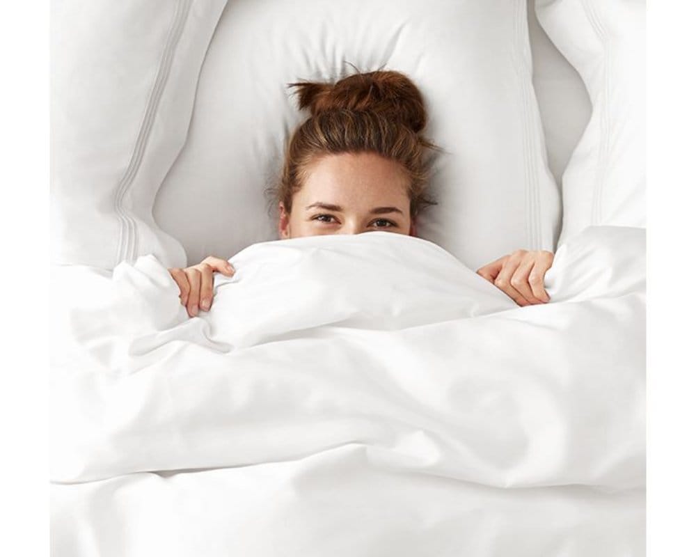 unhealthy to sleeping with blanket over head in winters