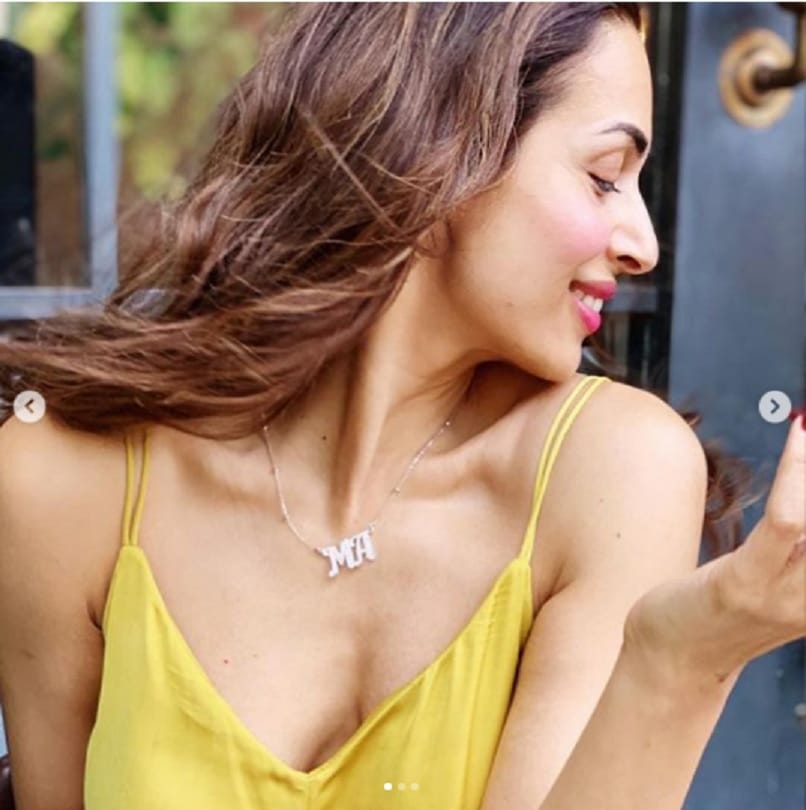 Malaika arora looks ravashing in lemon jumpsuit but her MA pendant is getting all the attention