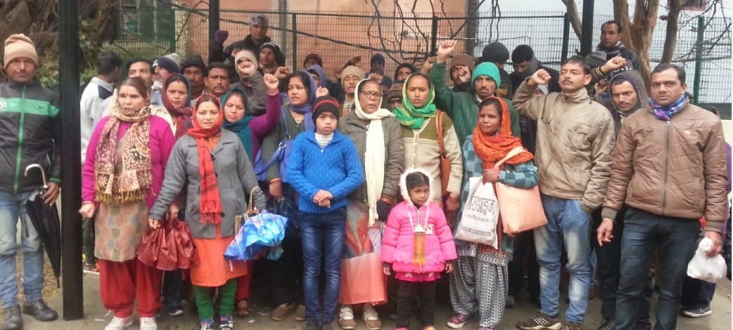 Alps staff sitting in front of children