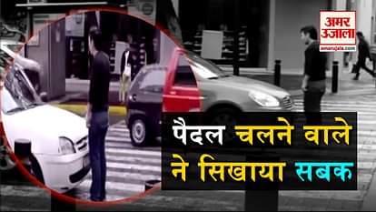 man standing in front of a car viral video