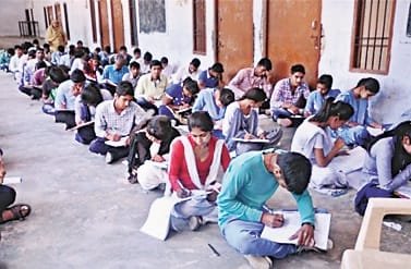 student will sit in ground and give exam 