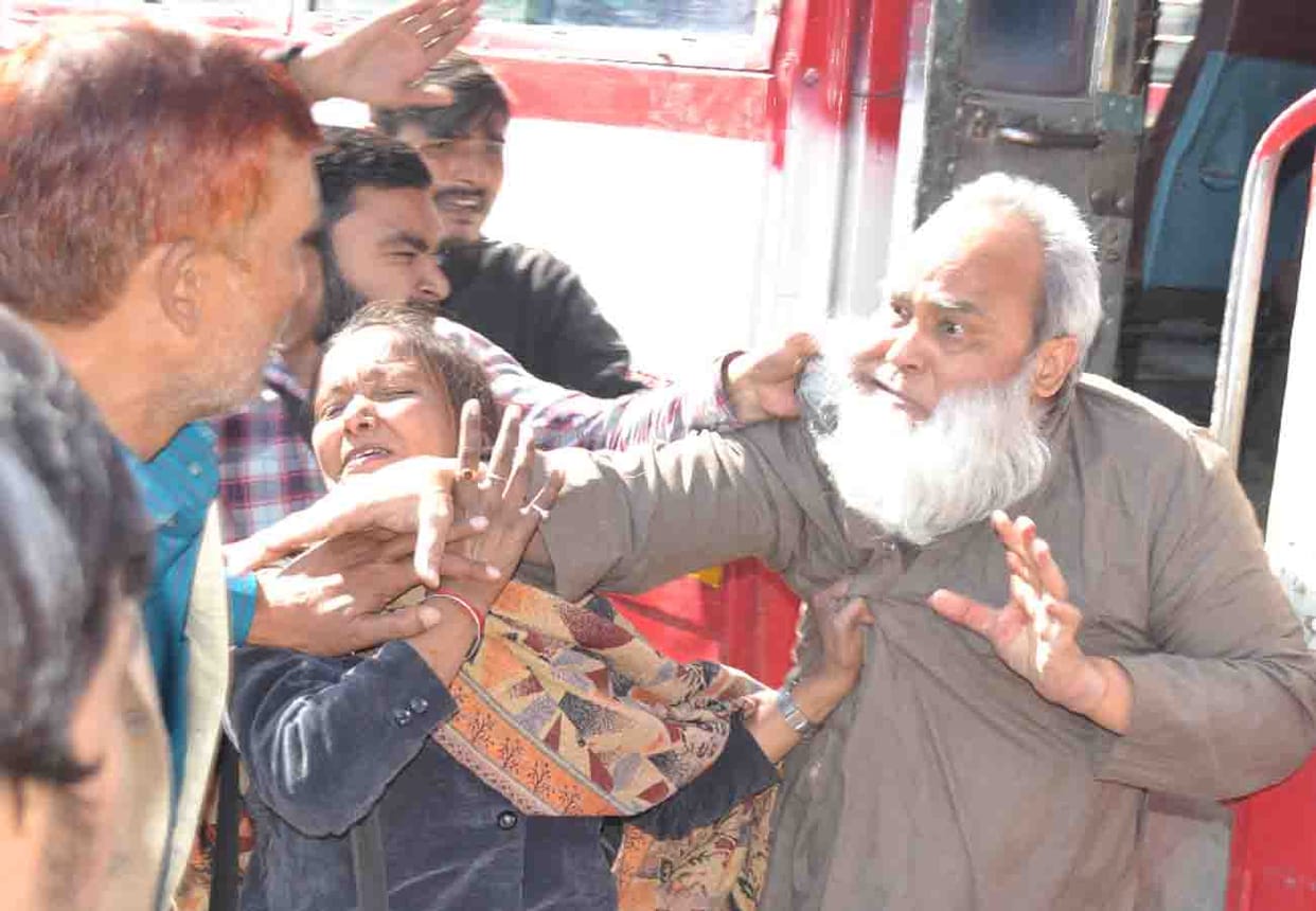Driver and operators beat ARM with sticks