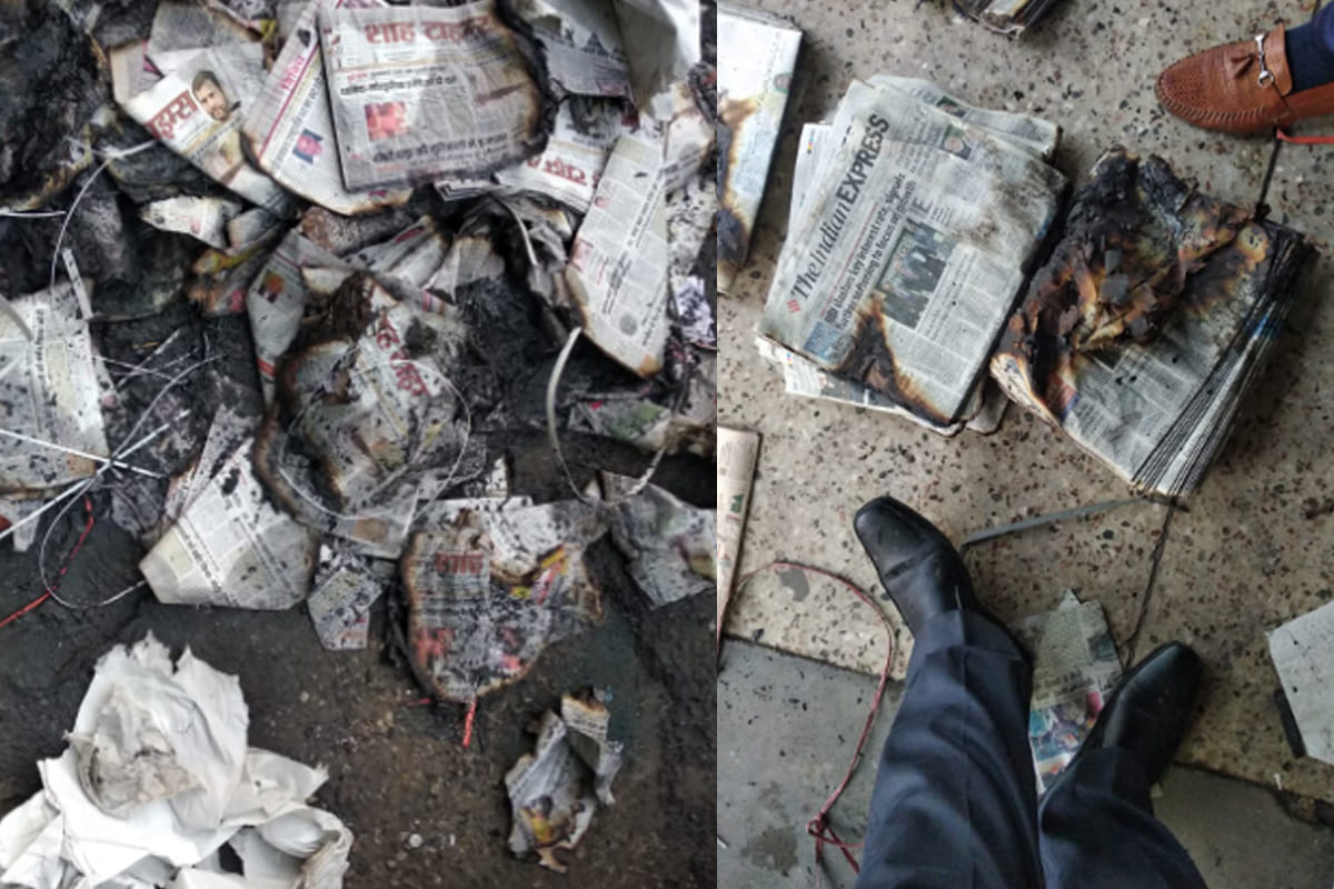 newspapers bundles on an agency fire up by people in Muzaffarnagar