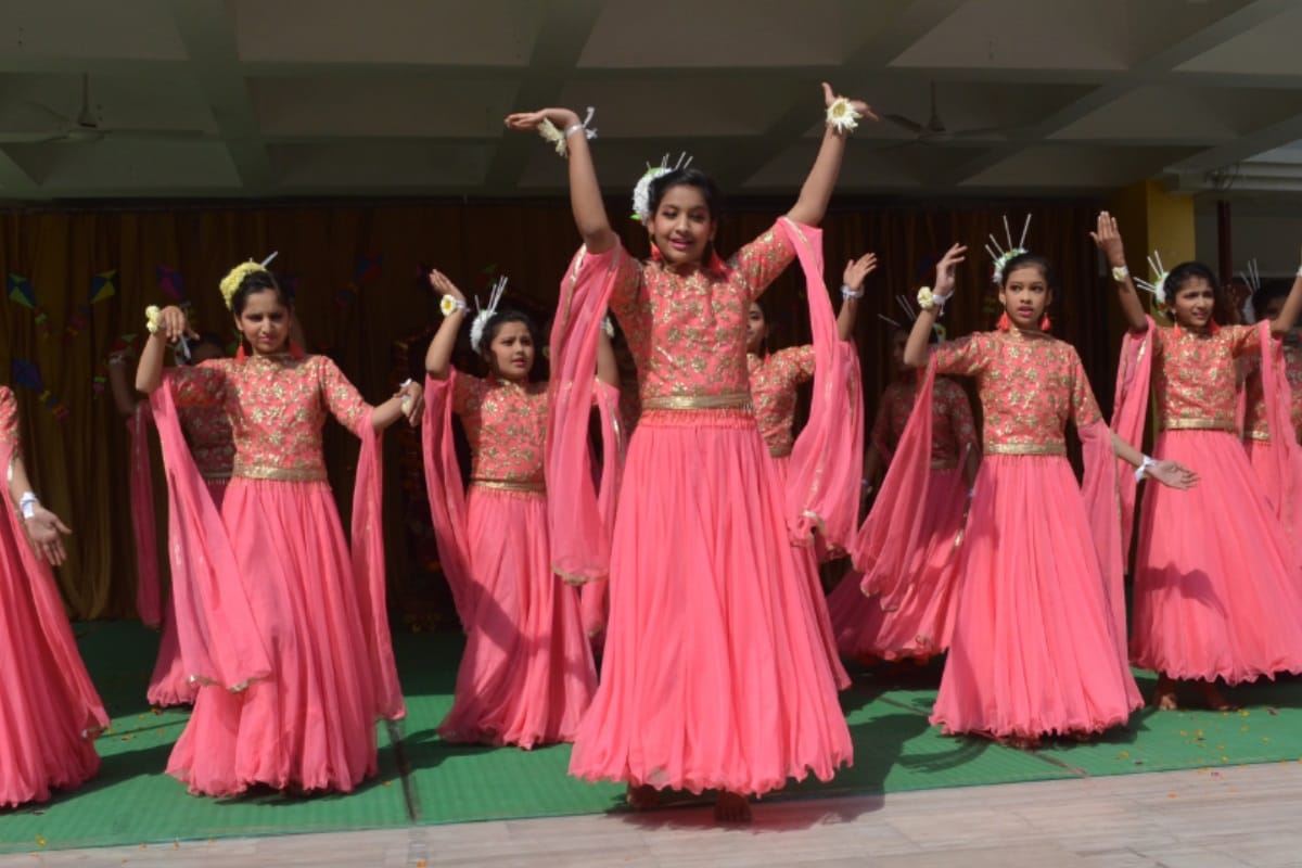 Girls perform dance on Basant panchmi kis plays with colorful kites