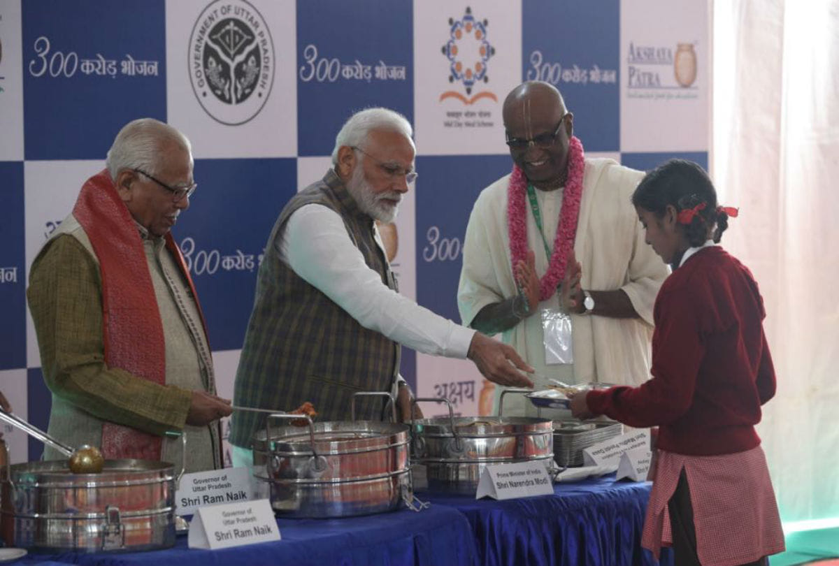 narendra modi, ram naik and yogi adityanath serving meal to children