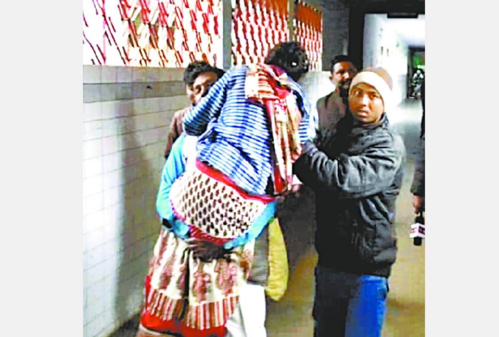 people carrying patients on their solider as lack of streachers