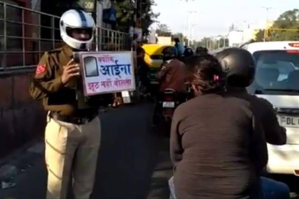 Delhi traffic police hold up mirror for not wearing helmet