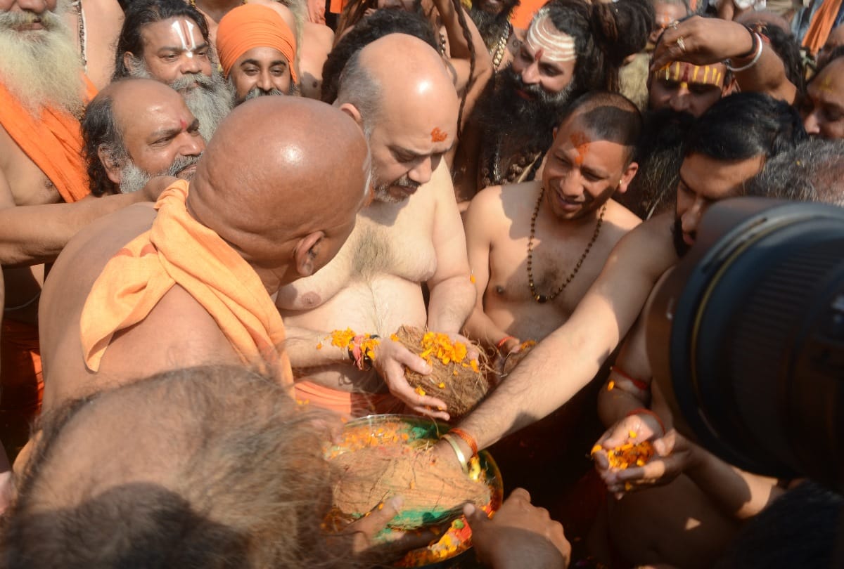 Narendra Modi Amit Shah Smriti Irani Yogi take holy dip during Kumbh Mela 2019