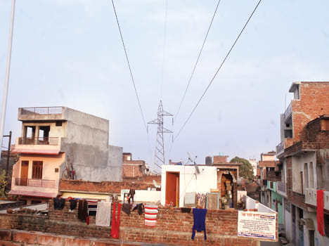 Highthan line from above homes, in danger