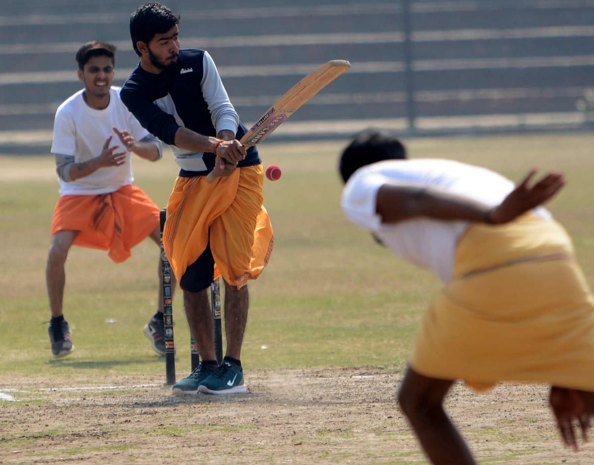 Cricket played in dhoti and commentry in sanskrit language in varanasi