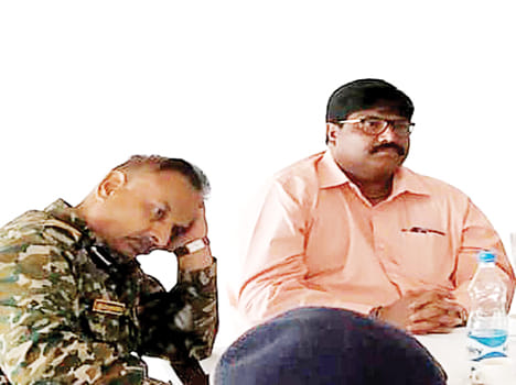 The shadow of the forehead is not seen by the officers holding the forehead
