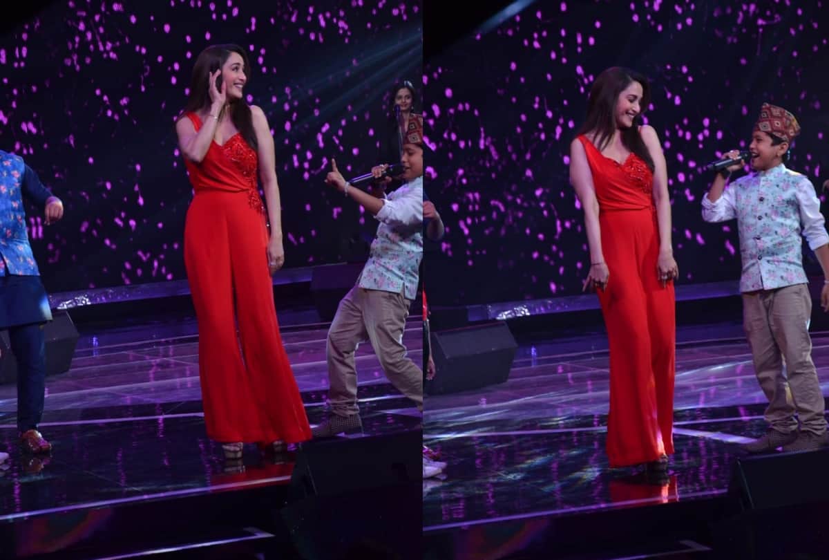 madhuri dixit look hot in this red jump suit