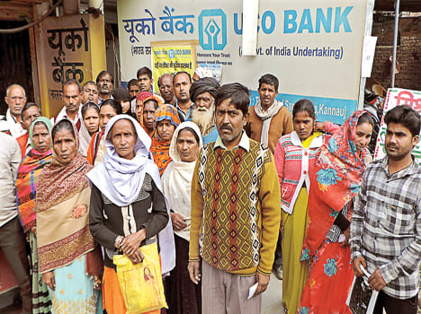 People walking around banks for Aadhaar card