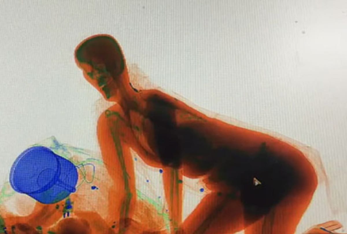 woman climbs into x-ray machine IN railway station with her luggage see viral video  