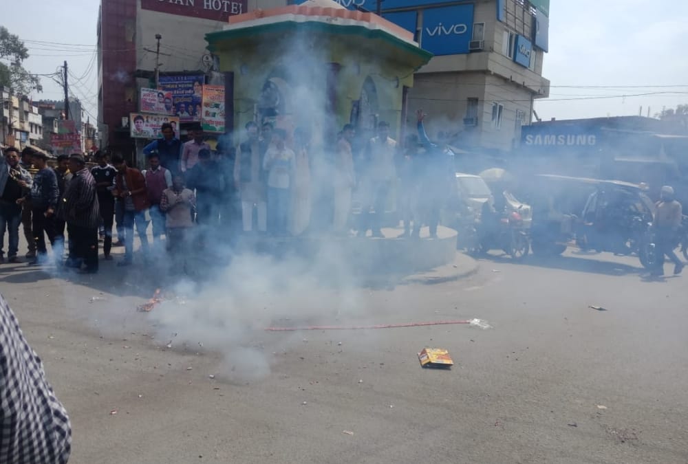 people celebrate the air strike by indian air force in pakistan.