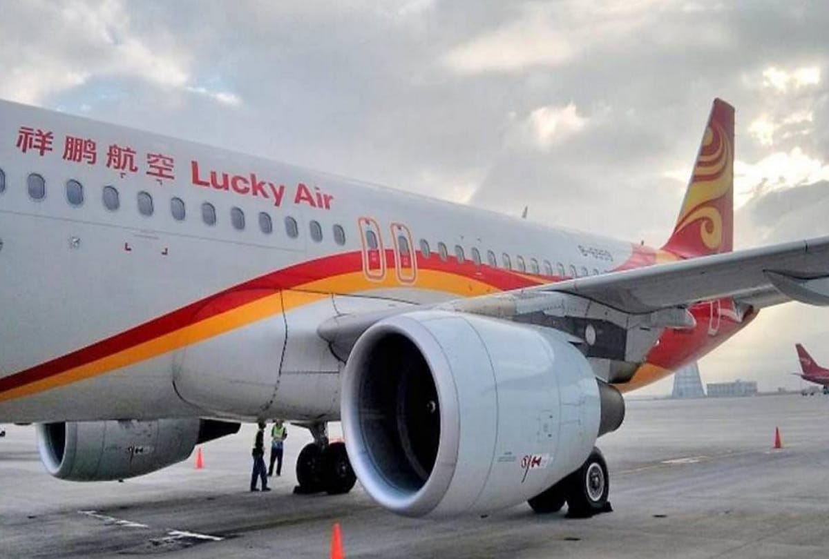 chinese man throws coins into airplane engine for good luck