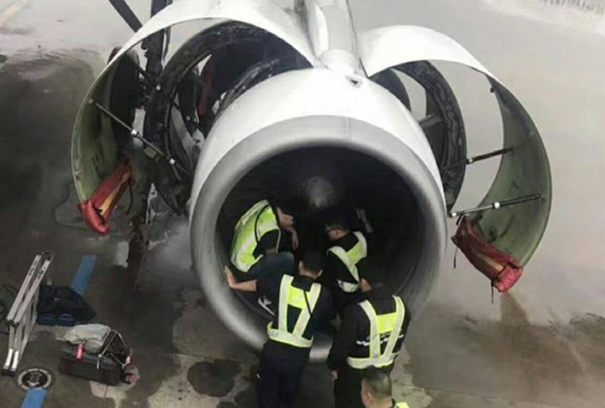chinese man throws coins into airplane engine for good luck