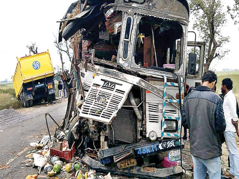 Two trucks collide, driver dies