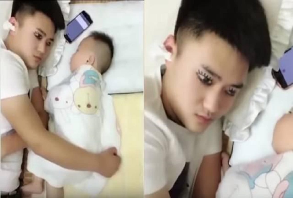 Exhausted man draws fake eyes drawn on eyelids to make baby thinking that he is awake see video 