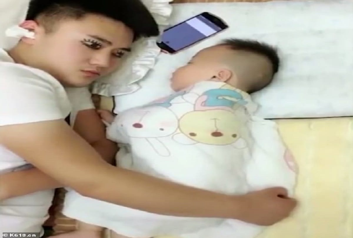 Exhausted man draws fake eyes drawn on eyelids to make baby thinking that he is awake see video 