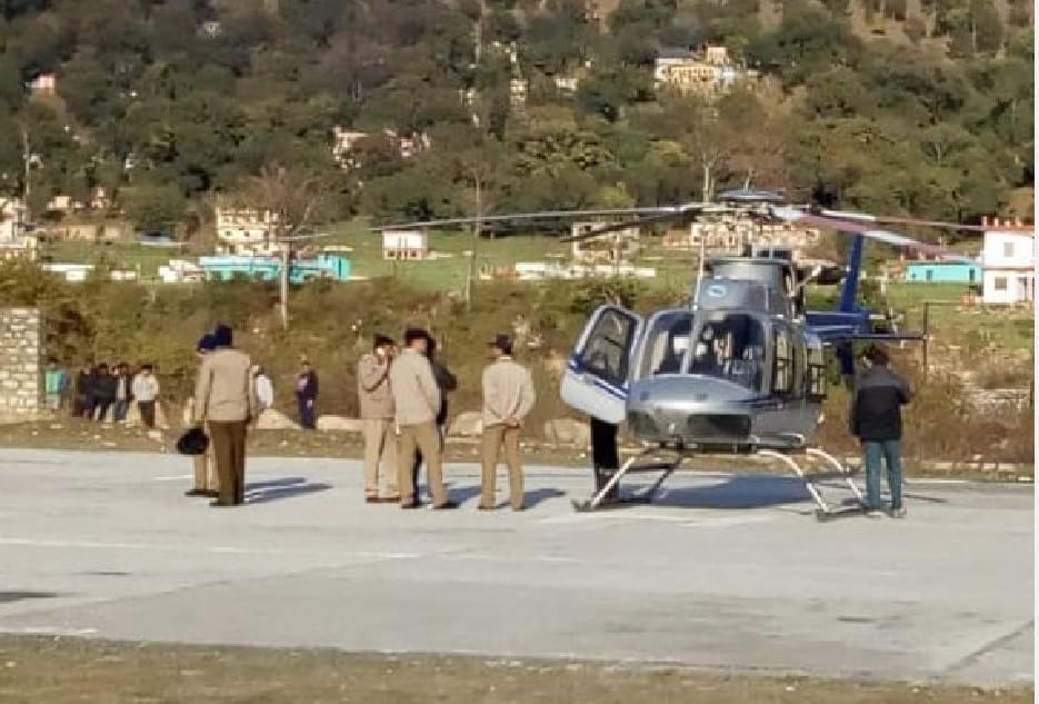 Helicopter landed in field full of players and spectators
