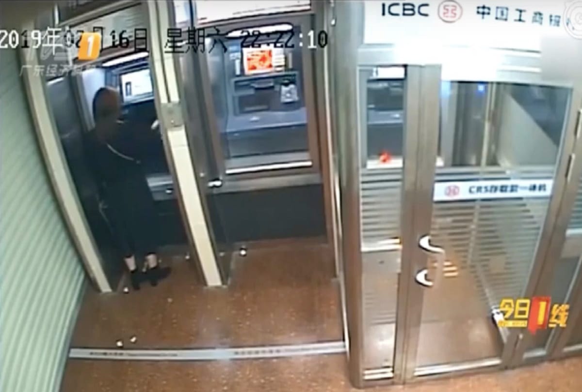 Man in China robs woman at ATM robber returns money after checking bank balance